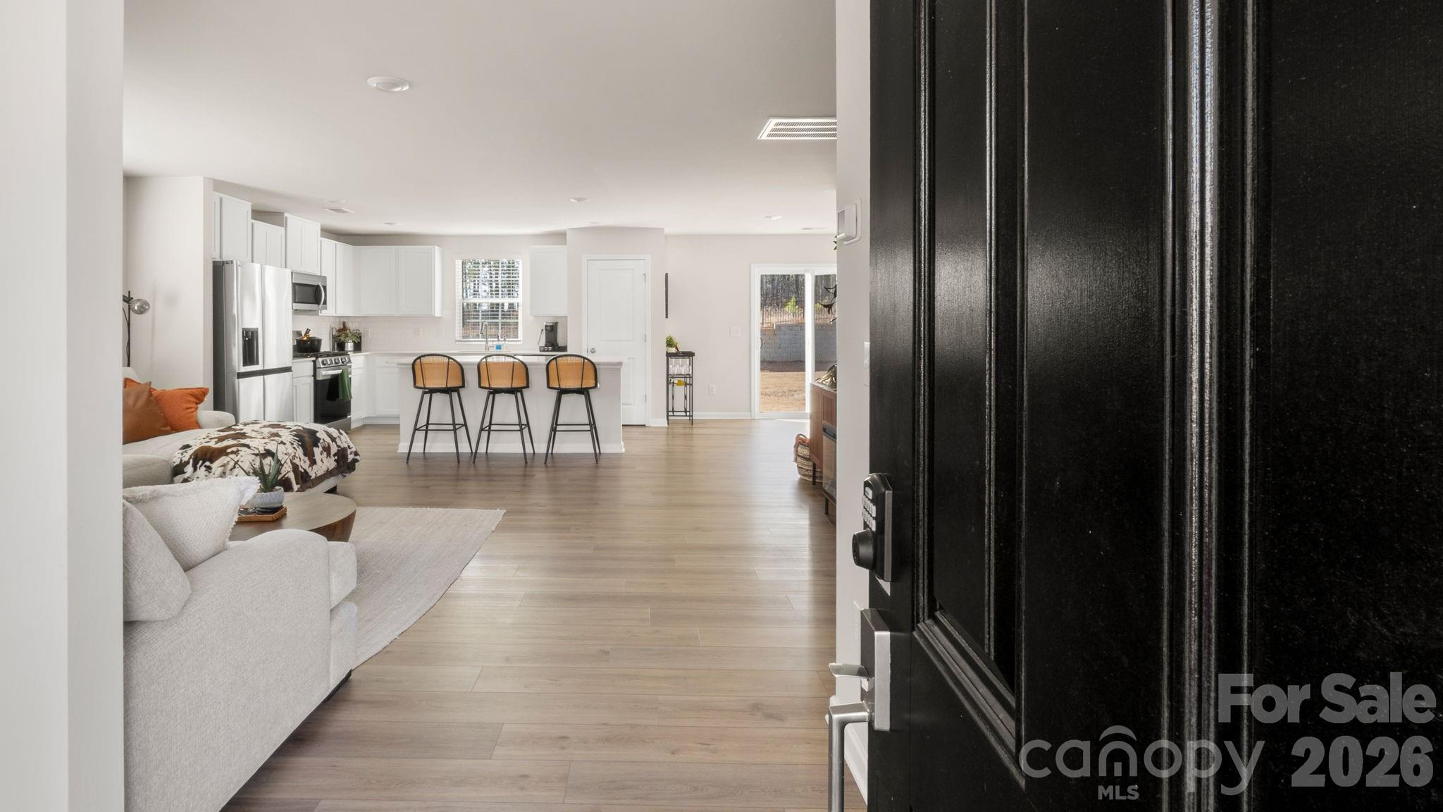 1615 Spring Edgemoor Sc 29712 Edgemoor, SC 29712 - Photo 4 of 30 a living room with lots of furniture and a chandelier