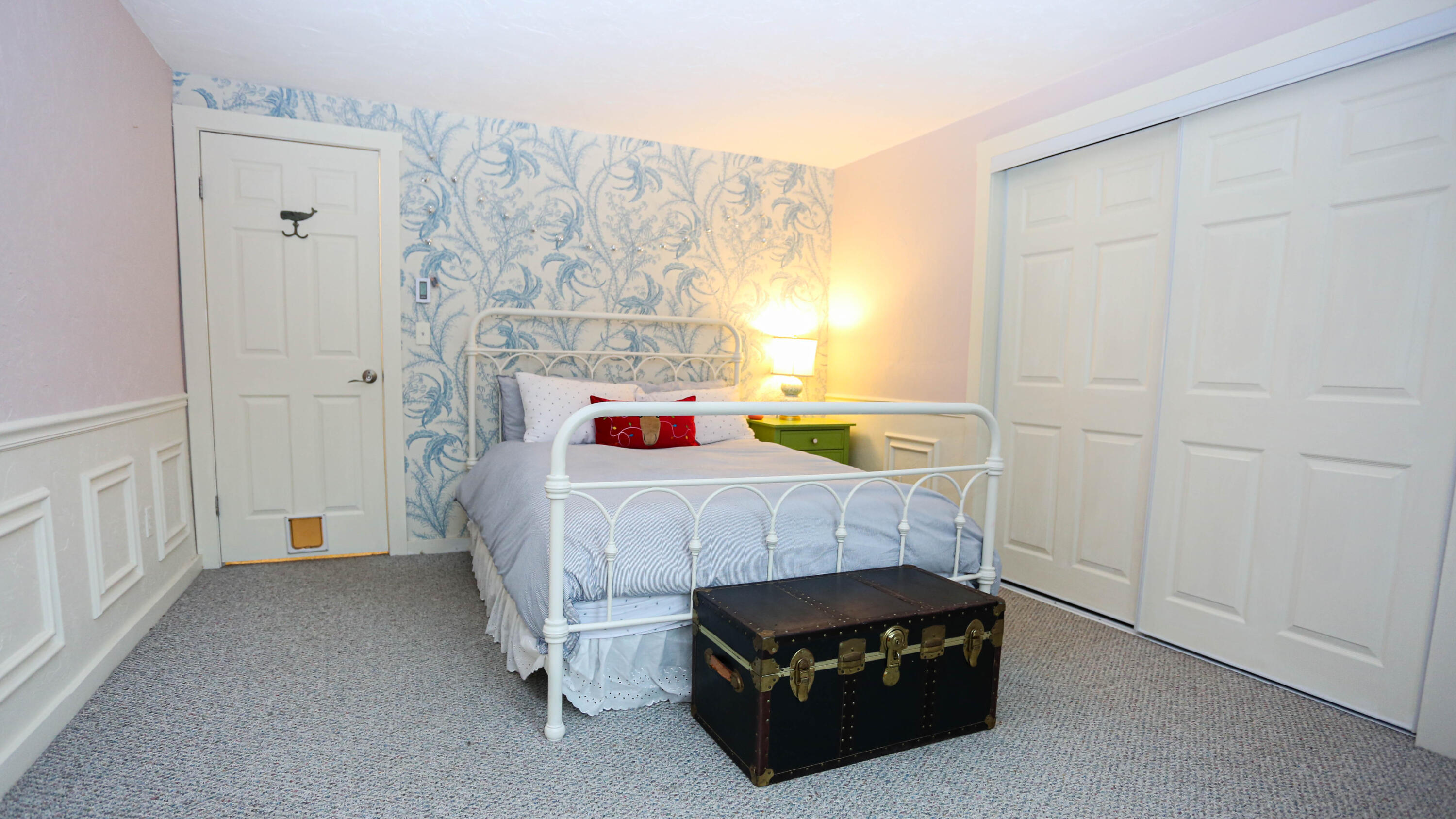 300 Falmouth Road, Unit 2C Mashpee, MA 02649 - Photo 13 of 17 a bed sitting in a bedroom next to a window and a bathroom