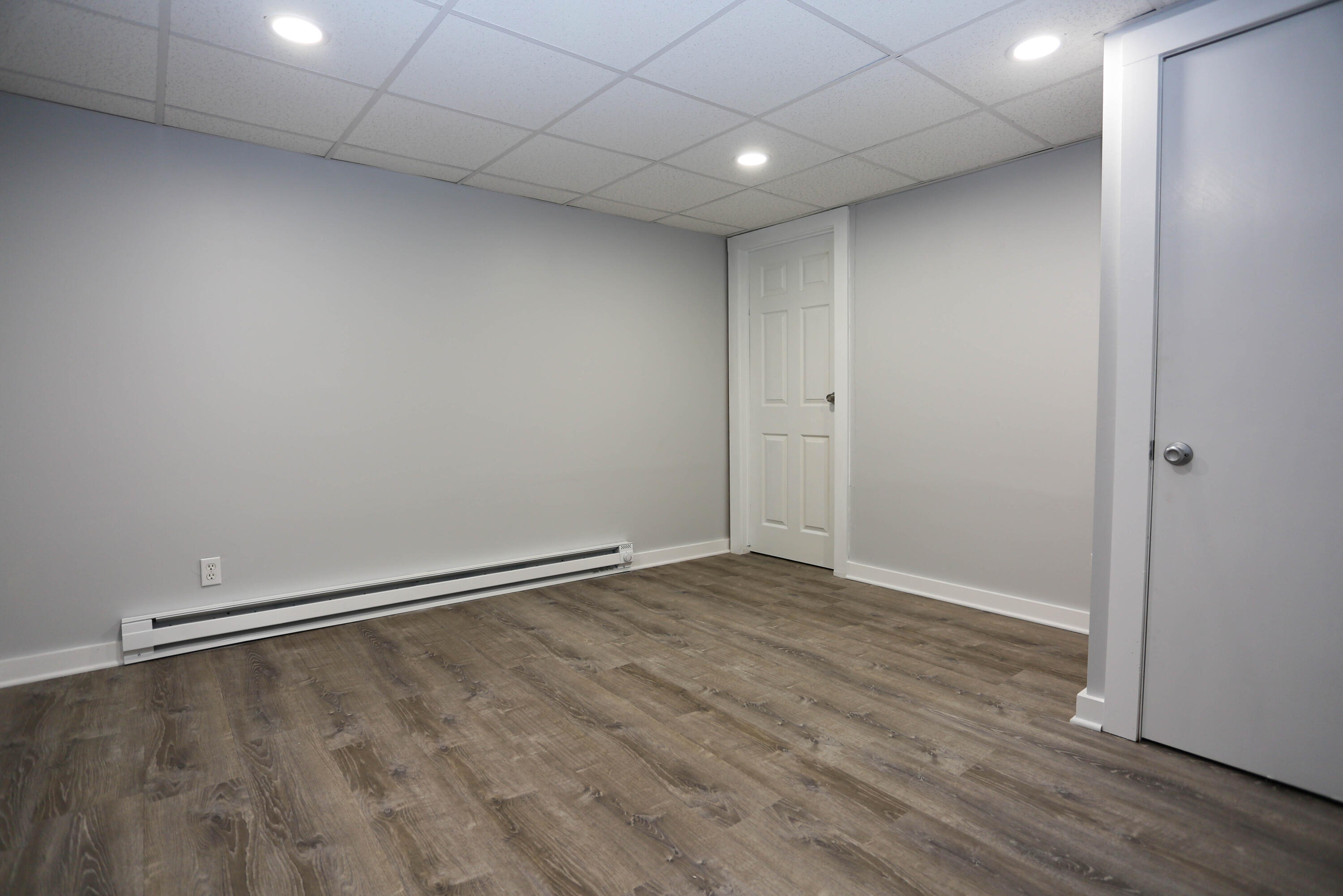 300 Falmouth Road, Unit 2C Mashpee, MA 02649 - Photo 16 of 17 a view of an empty room with wooden floor