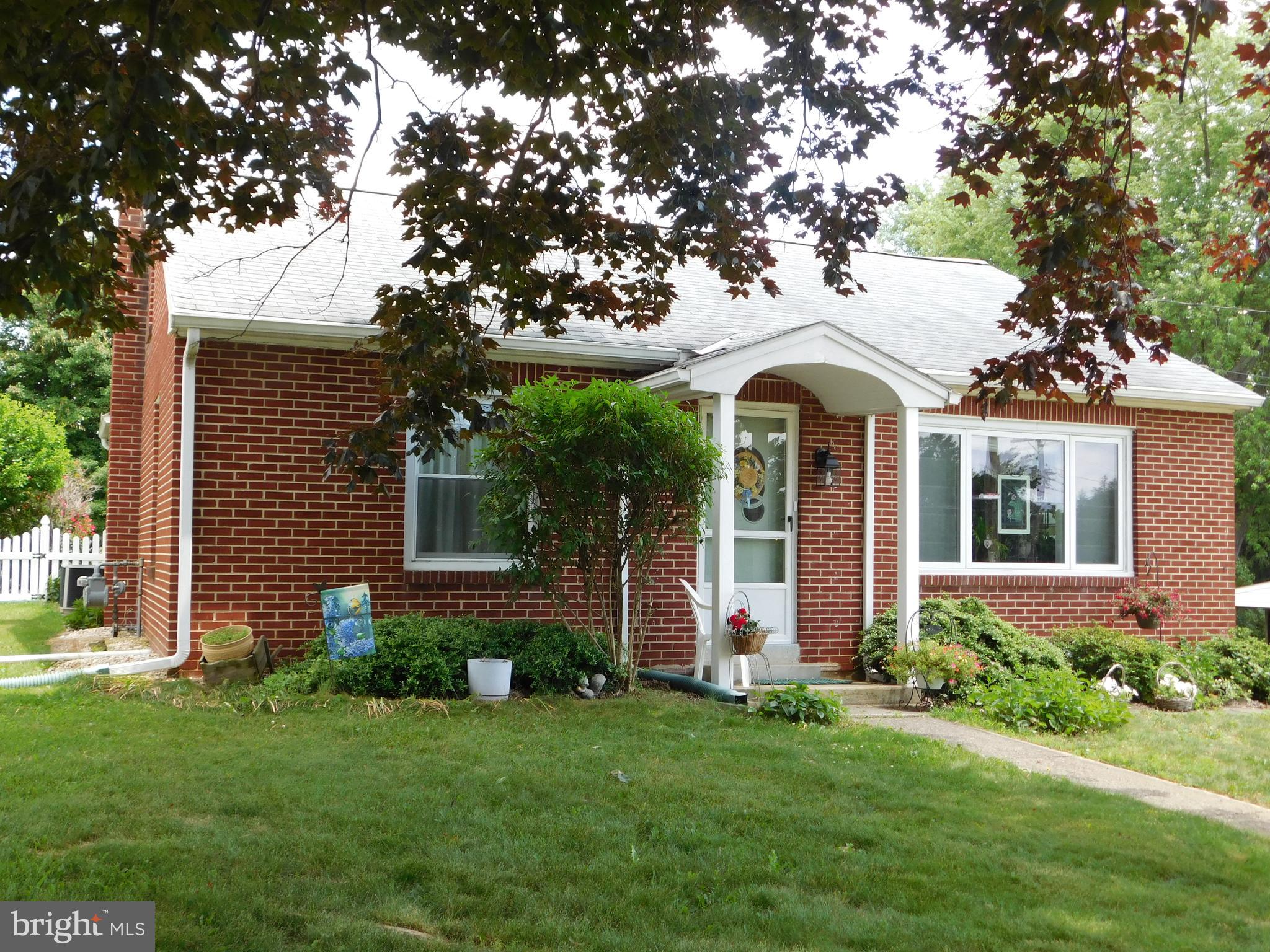 407 Chancellor Road York, PA 17403 - Photo 1 of 30 Front of home with covered entry and storm door