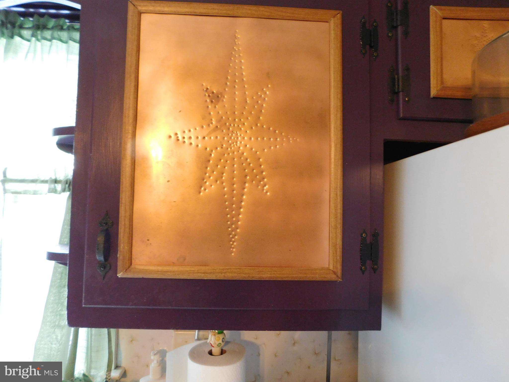 407 Chancellor Road York, PA 17403 - Photo 11 of 30 Unique custom punched copper inserts in cabinets