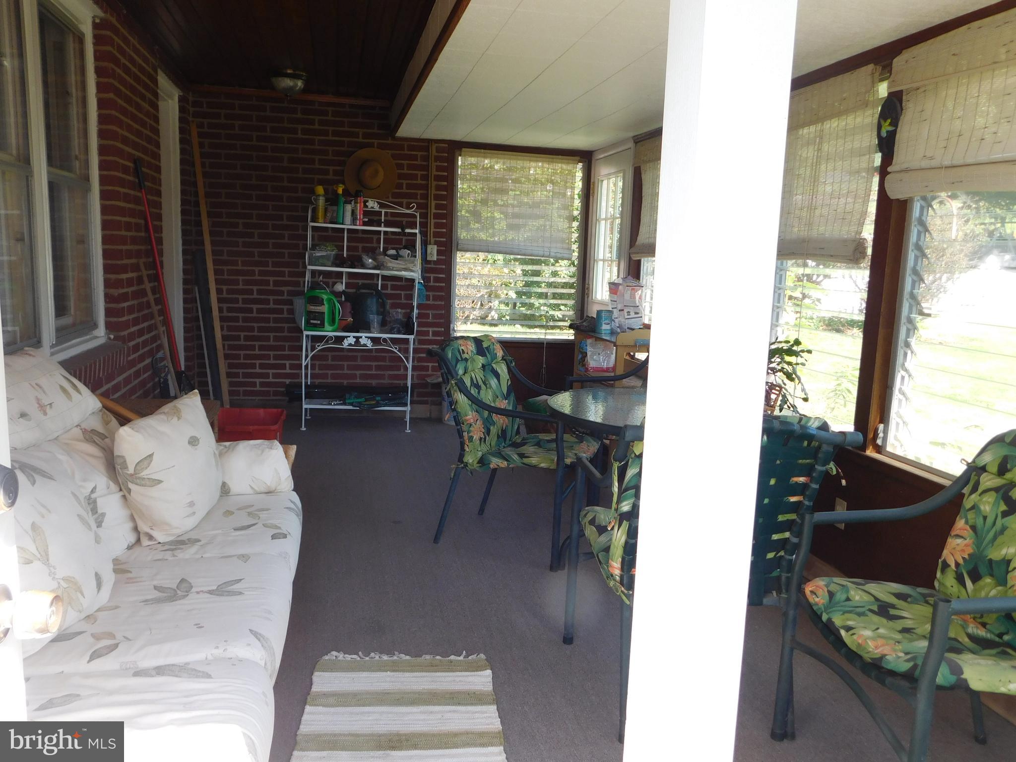 407 Chancellor Road York, PA 17403 - Photo 15 of 30 Sunporch has door to yard & one to driveway