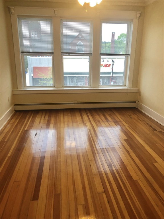 27 High Street, Unit 1 Clinton, MA 01510 - Photo 27 of 30 a view of a room with wooden floor and windows
