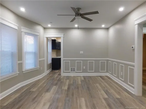 a view of a livingroom with wooden floor