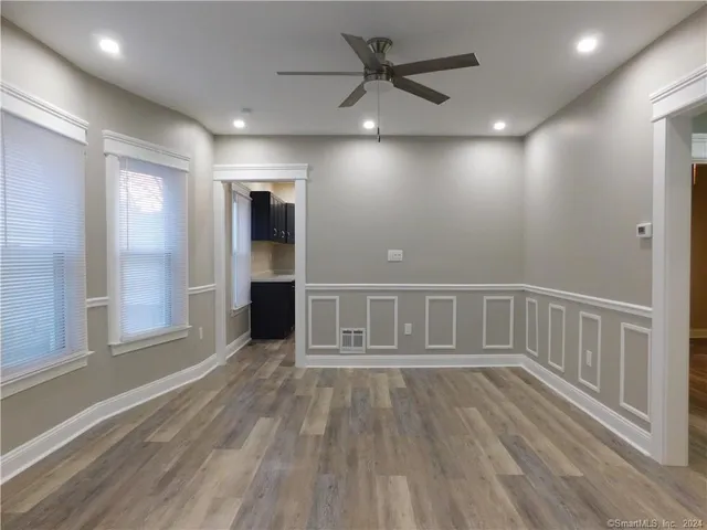 a view of a livingroom with wooden floor