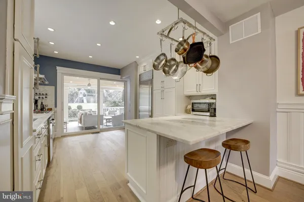 a kitchen with a table and chairs in it