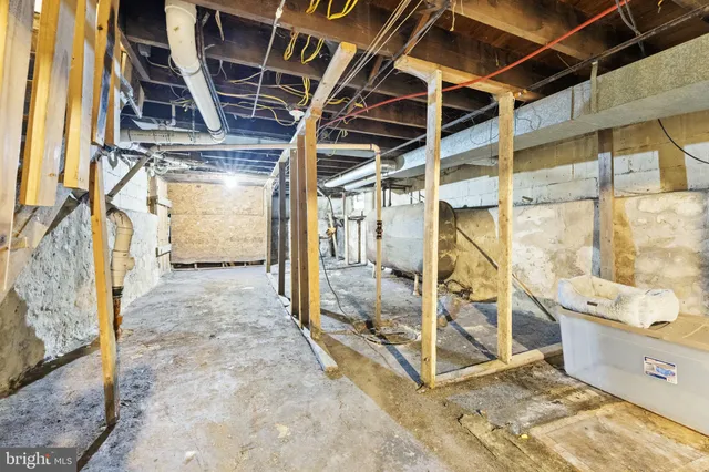 a view of empty room with wooden walls