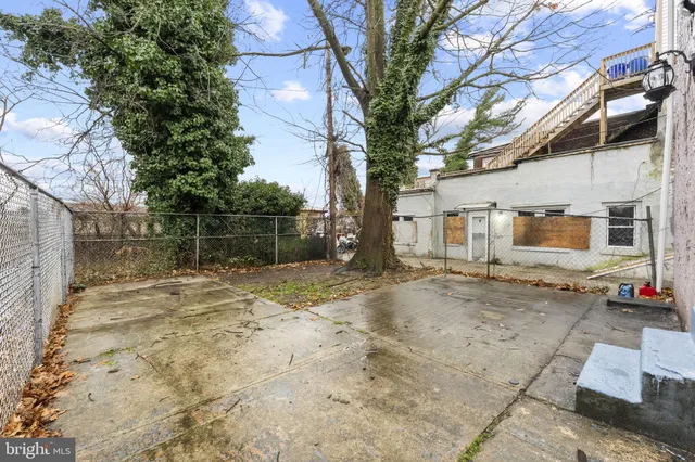 a view of a white apartments with large windows