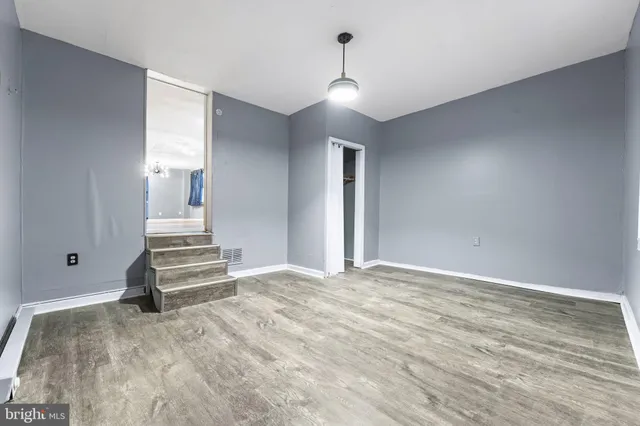 a view of a livingroom with stairs