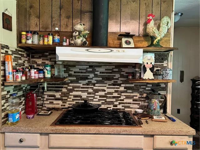 a kitchen view of a stove