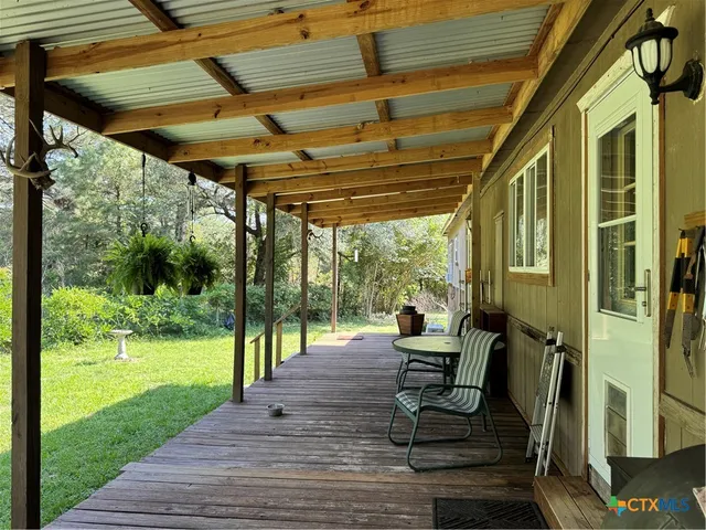 a view of a car park in front of a house