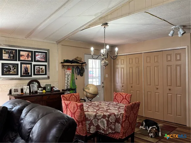 a bedroom with bed and window