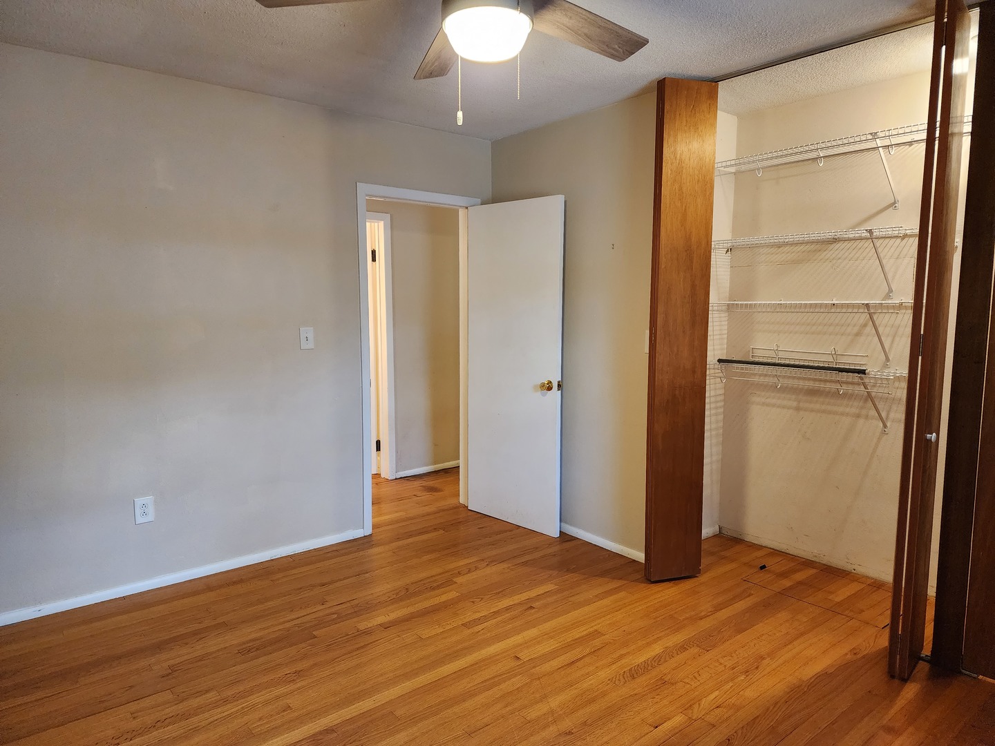 1825 Crescent Drive Champaign, IL 61821 - Photo 14 of 24 a view of an empty room with wooden floor