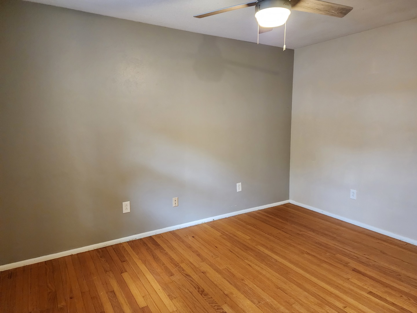 1825 Crescent Drive Champaign, IL 61821 - Photo 15 of 24 a view of an empty room with a chandelier fan