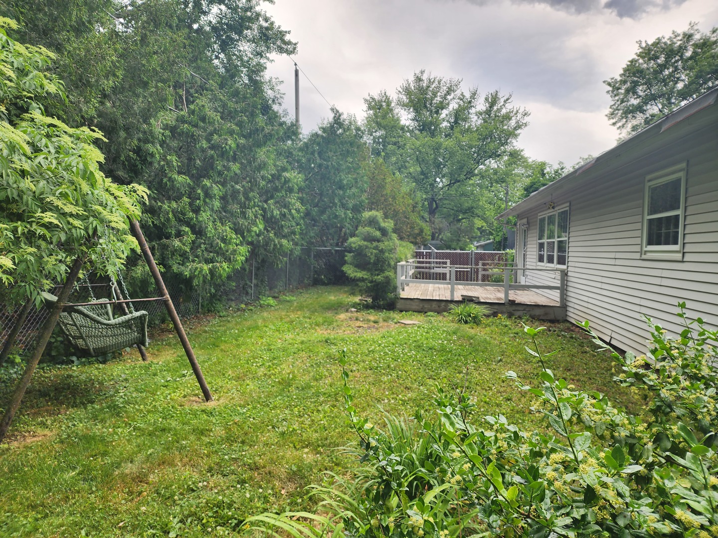 1825 Crescent Drive Champaign, IL 61821 - Photo 19 of 24 a backyard of a house with lots of green space