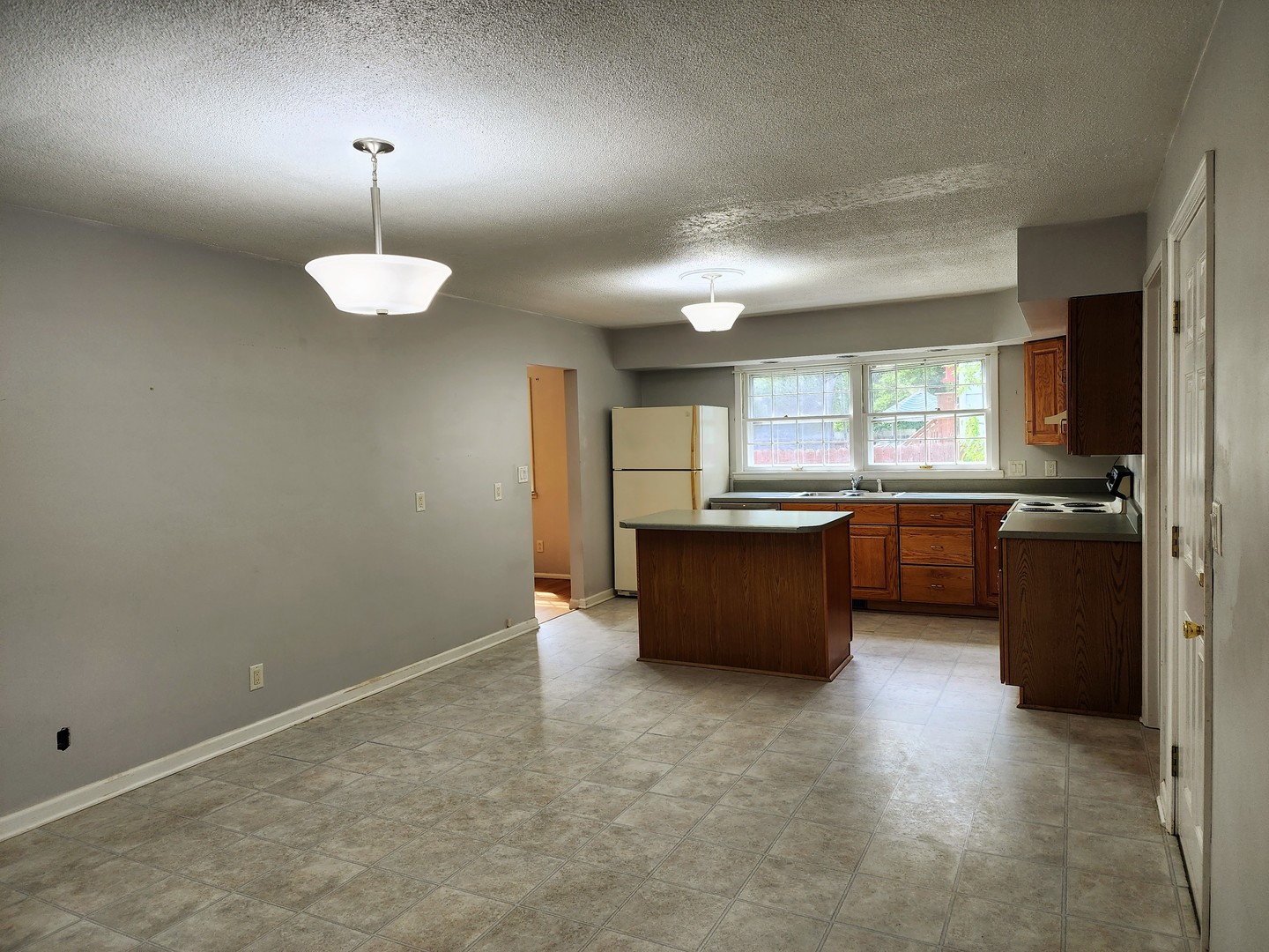 1825 Crescent Drive Champaign, IL 61821 - Photo 2 of 24 a view of a kitchen with a sink and cabinets