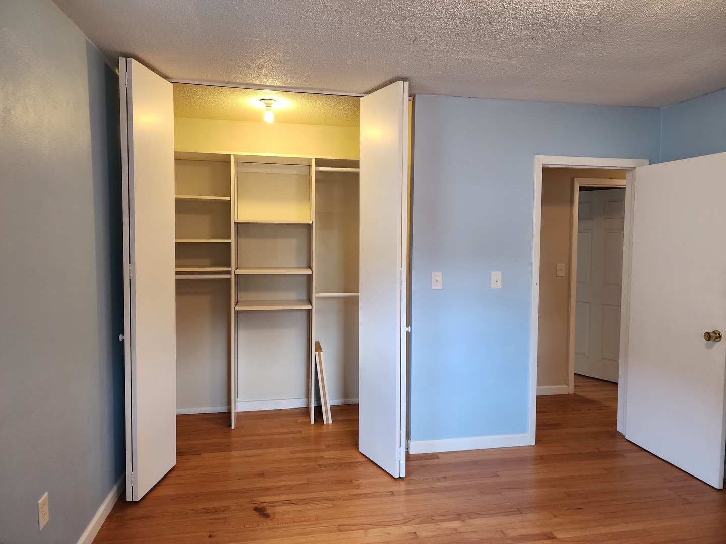 1825 Crescent Drive Champaign, IL 61821 - Photo 6 of 24 a view of an empty room with wooden floor & closet