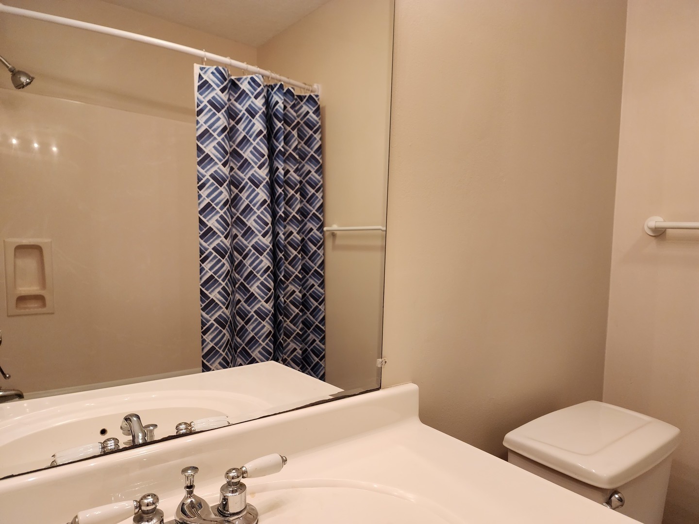 1825 Crescent Drive Champaign, IL 61821 - Photo 9 of 24 a bathroom with a toilet and a shower curtain