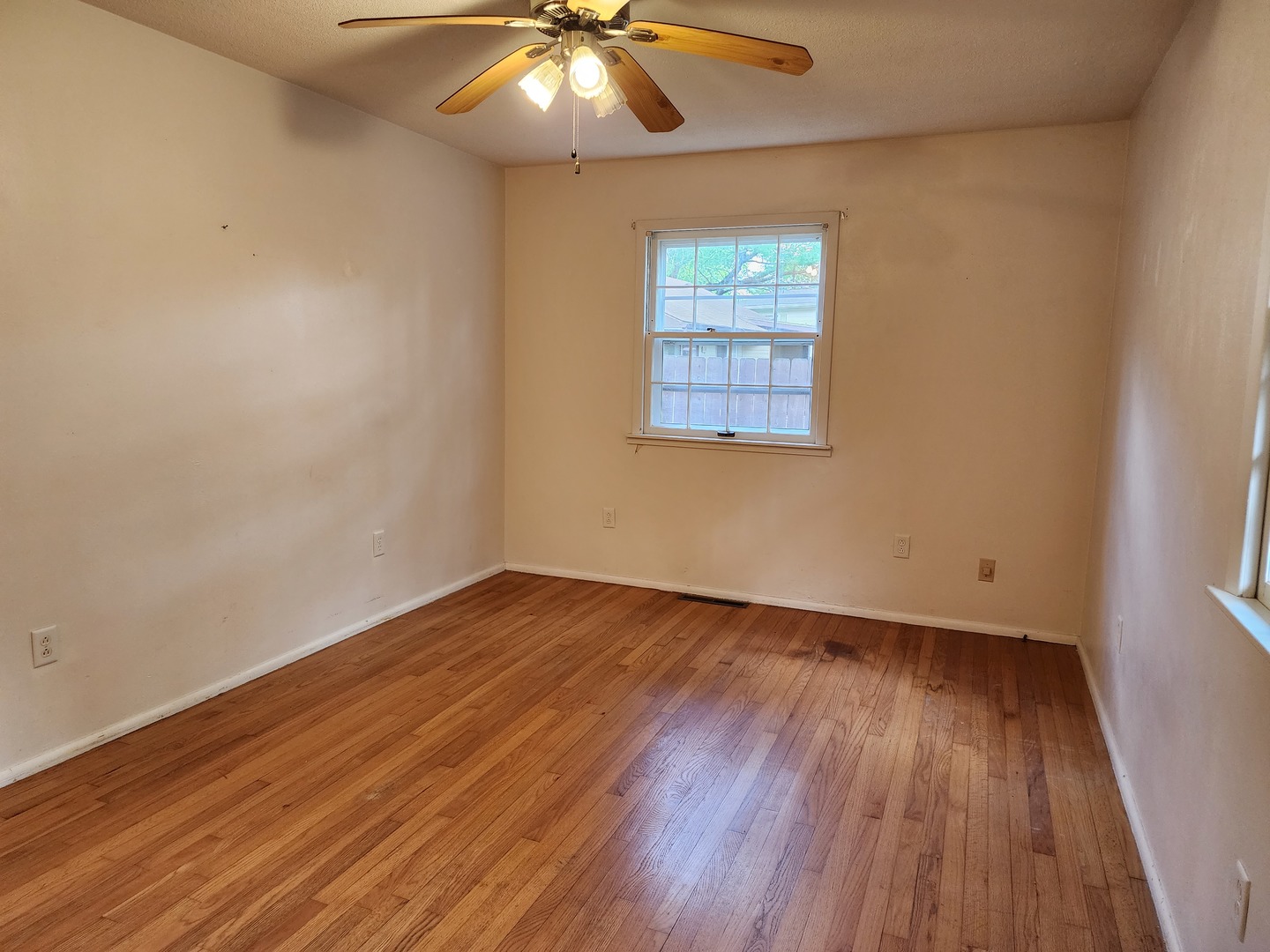 1825 Crescent Drive Champaign, IL 61821 - Photo 10 of 24 an empty room with wooden floor and windows