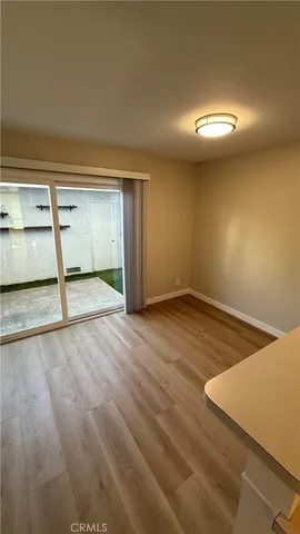 a view of kitchen and wooden floor