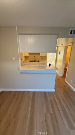 a kitchen with granite countertop a sink and a stove top oven