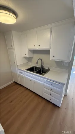 a view of a hallway and closet with mirror
