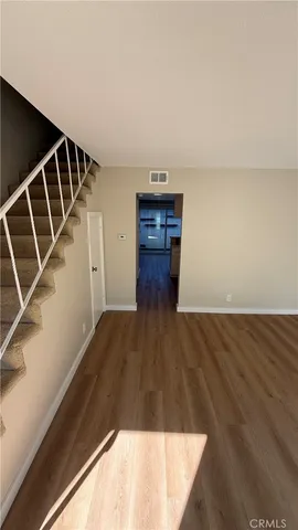 a view of a kitchen with wooden floor