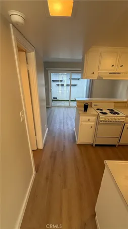 a kitchen with stainless steel appliances a stove a sink and a refrigerator