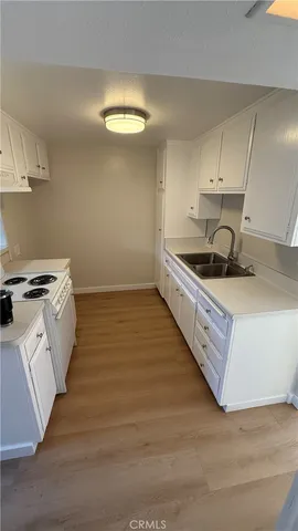 an empty room with wooden floor