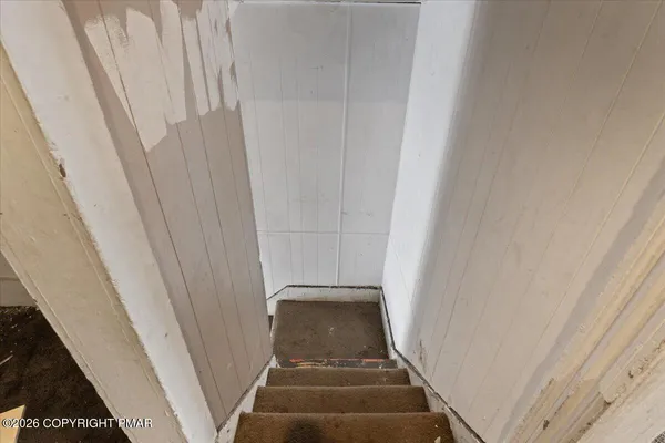 a bathroom with a toilet and a sink