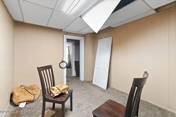 a view of a hallway with seating area
