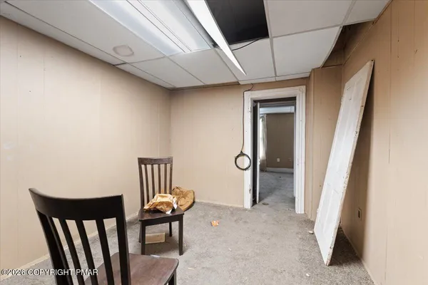 a view of a hallway with chairs