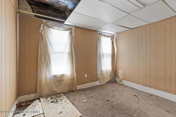 a view of a hallway with closet