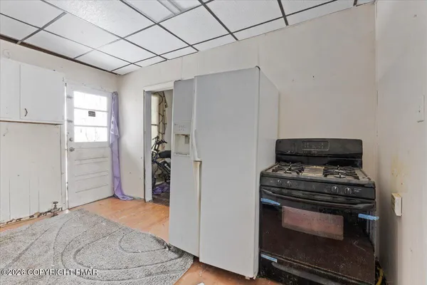 a view of a livingroom with furniture and a flat screen tv