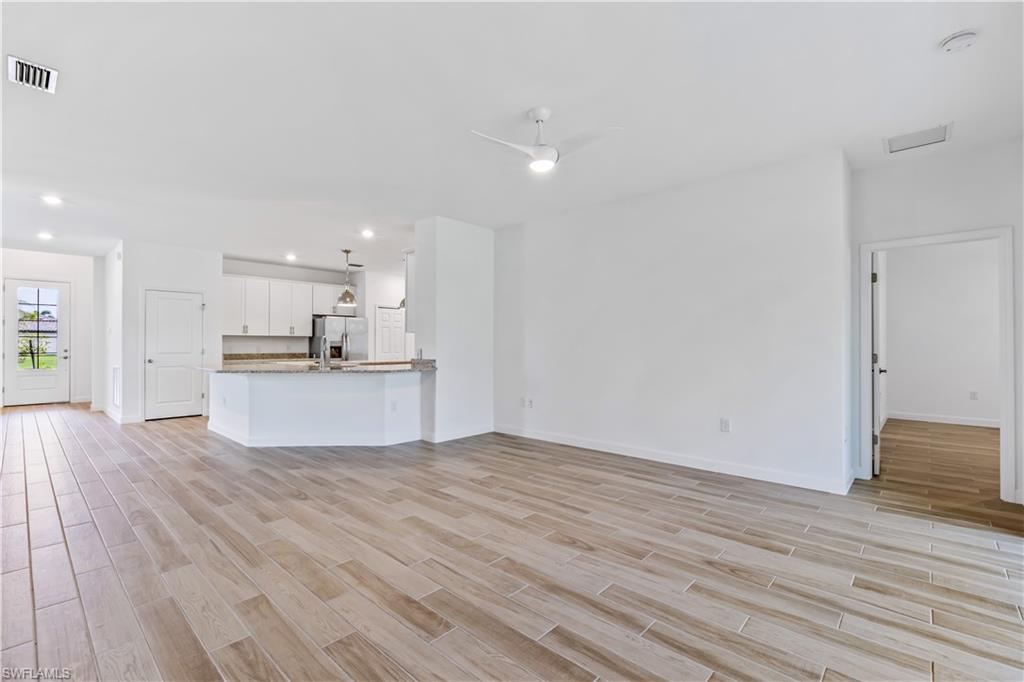 1817 Lema Court Naples, FL 34120 - Photo 11 of 22 a view of kitchen with wooden floor