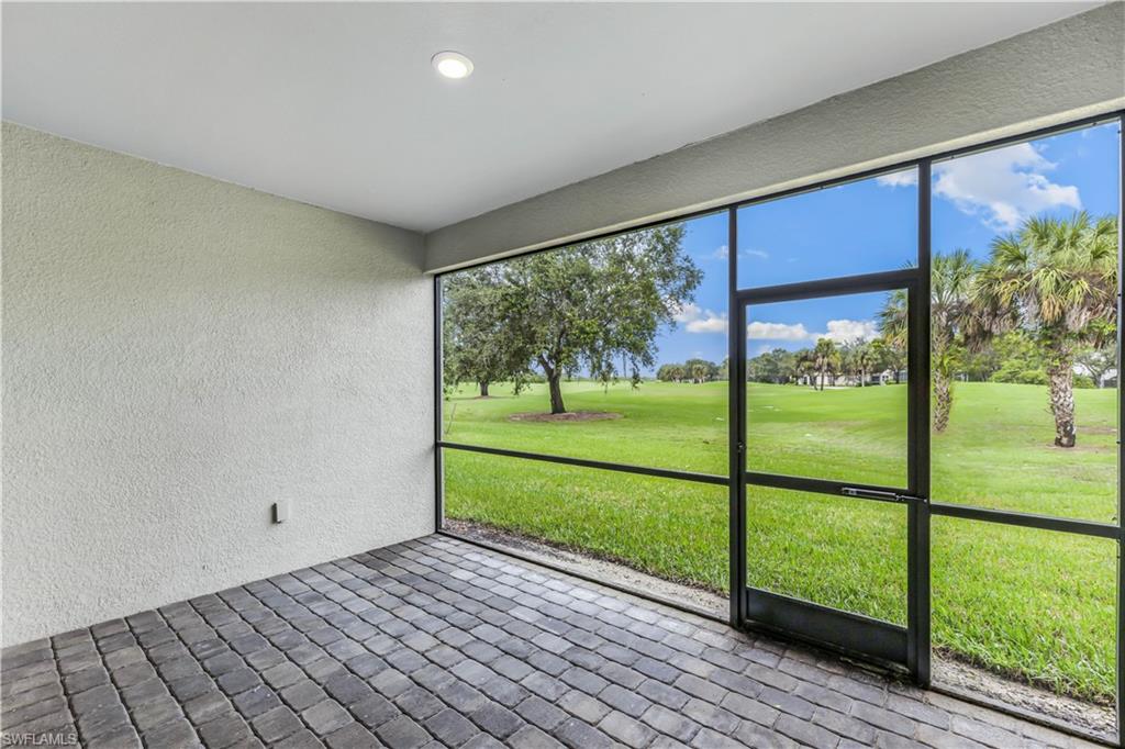 1817 Lema Court Naples, FL 34120 - Photo 12 of 22 a view of an empty room with a large window