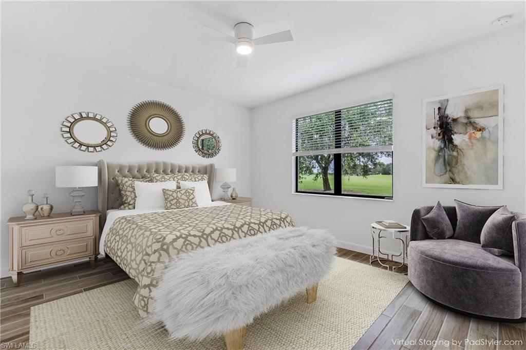 1817 Lema Court Naples, FL 34120 - Photo 13 of 22 a bedroom with a bed and wooden floor
