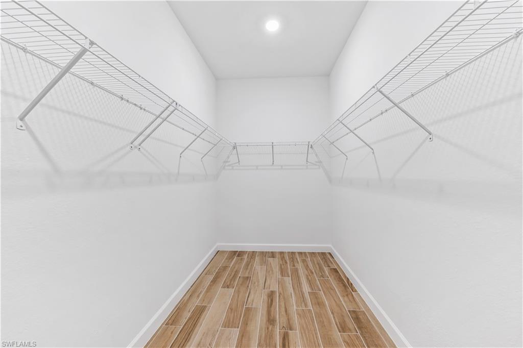 1817 Lema Court Naples, FL 34120 - Photo 15 of 22 a view of a room with racks on the wall