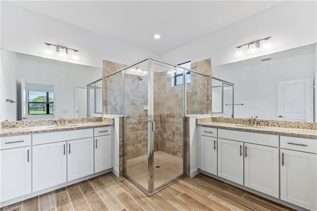 1817 Lema Court Naples, FL 34120 - Photo 17 of 22 a bathroom with a granite countertop sink mirror and double