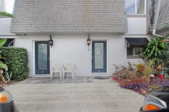 a front view of a house with outdoor seating