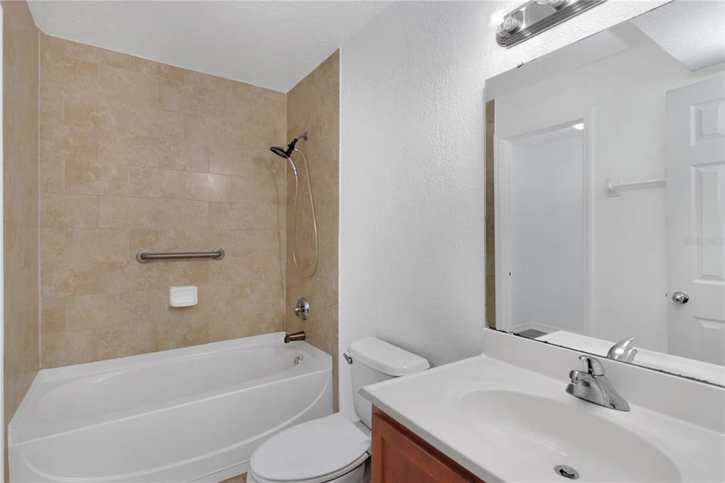 1946 South Conway Road, Unit 4 Orlando, FL 32812 - Photo 15 of 20 a bathroom with a sink toilet and bathtub