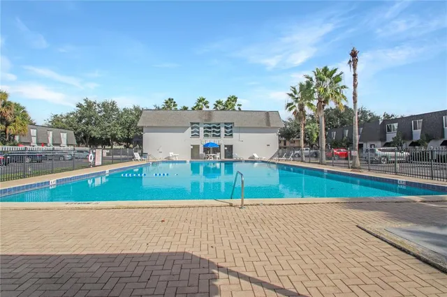 a view of outdoor space with a swimming pool