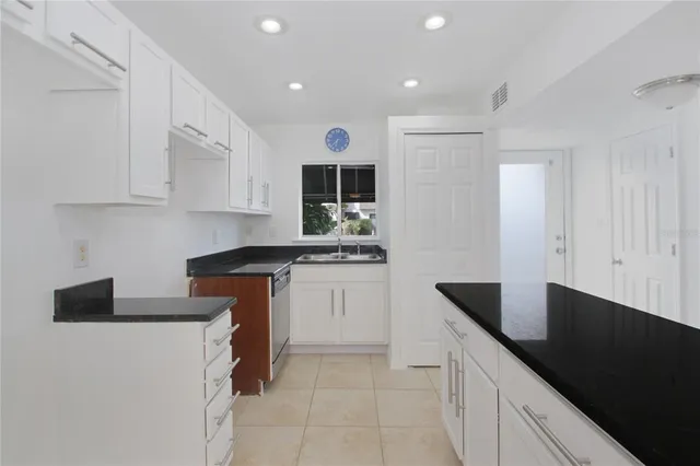 a kitchen with a sink and cabinets