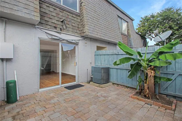 a view of a porch with a potted plant