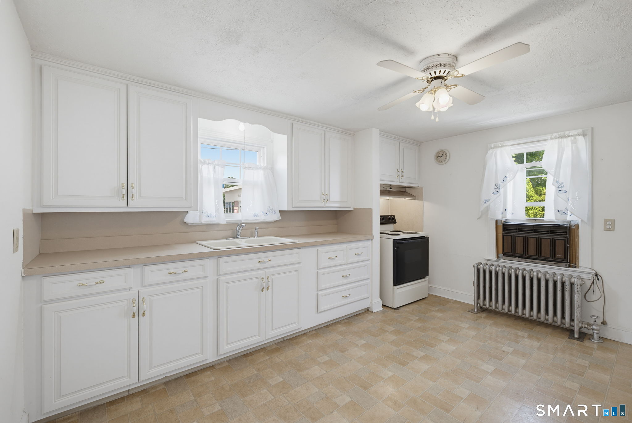 417 Hartford Road Manchester, CT 06040 - Photo 7 of 38 Kitchen opens to living room and enclosed porch.