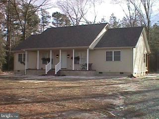 34315-5 5 Bridges Road Princess Anne, MD 21853 - Photo 1 of 1 a view of the house with backyard