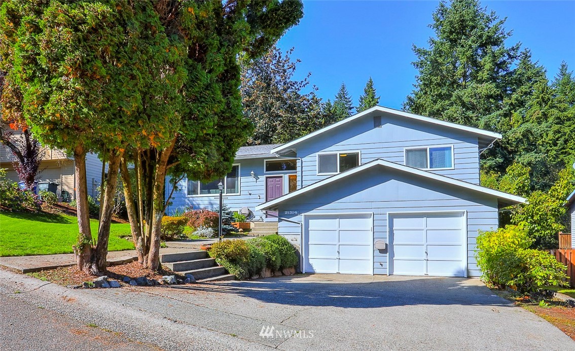 21314 2nd Avenue Southeast Bothell, WA 98021 - Photo 1 of 25 a view of a house with a yard plants and palm trees