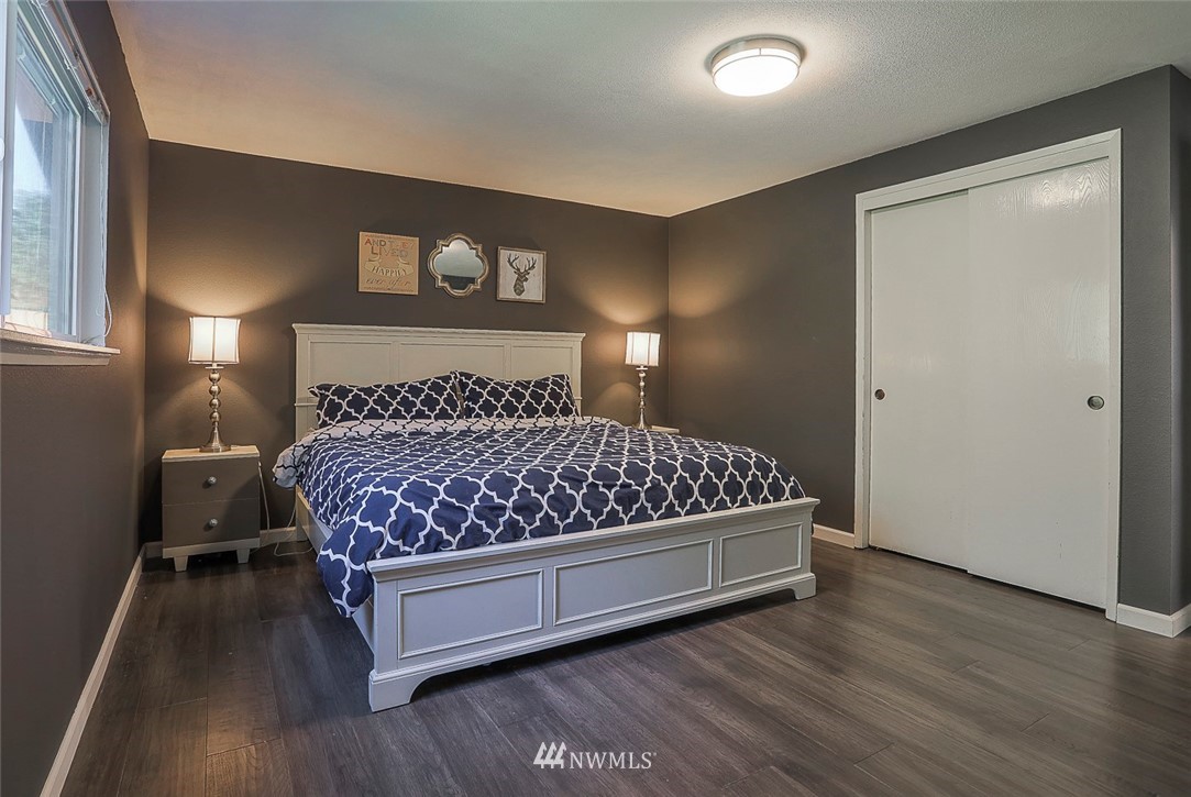 21314 2nd Avenue Southeast Bothell, WA 98021 - Photo 13 of 25 a bedroom with a bed and a night stand