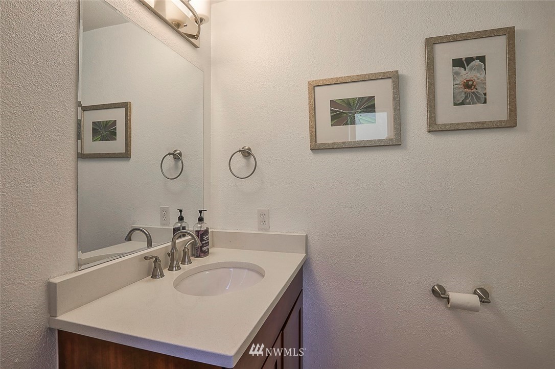 21314 2nd Avenue Southeast Bothell, WA 98021 - Photo 15 of 25 a bathroom with a sink vanity and a mirror