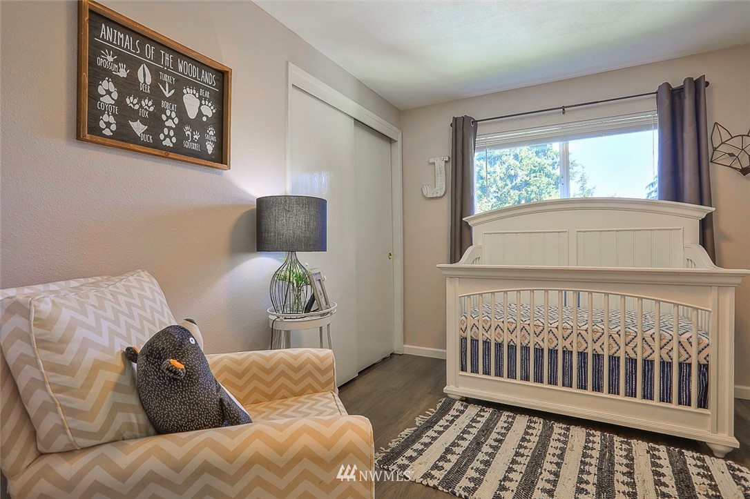 21314 2nd Avenue Southeast Bothell, WA 98021 - Photo 16 of 25 a bedroom with a bed and window